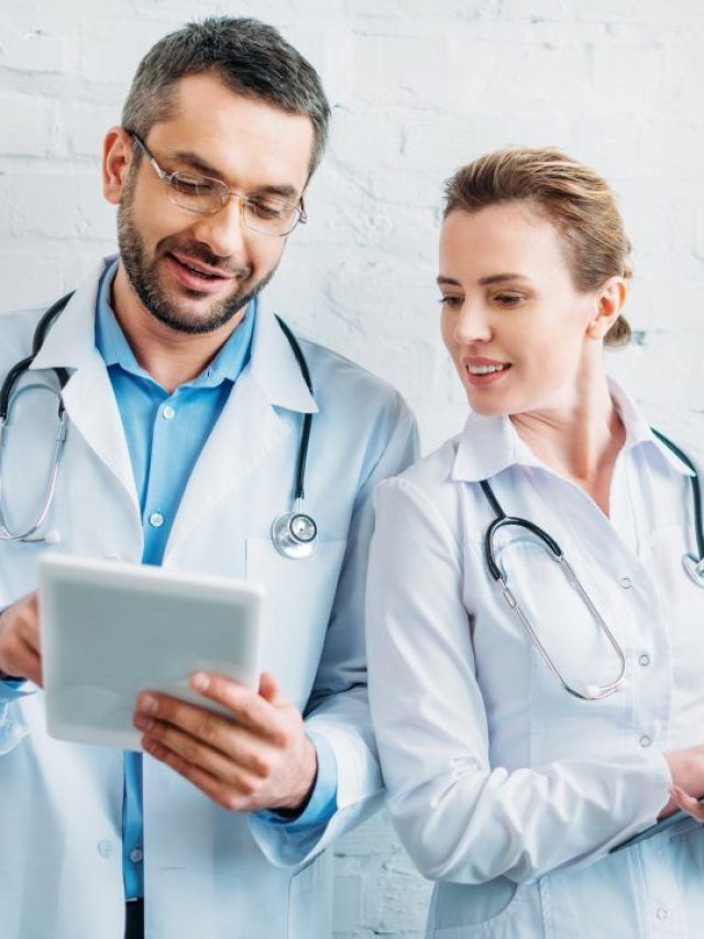 cropped-happy-doctors-working-together-with-tablet-and-clipboard.jpg