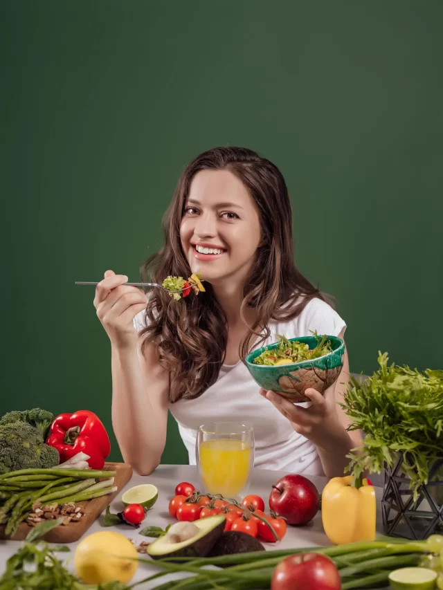 young-woman-eating-healthy-food-green-background